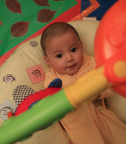 baby playing with a mobile