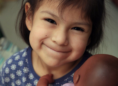 child playing with a doll