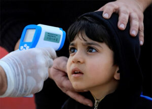 child getting temperature taken